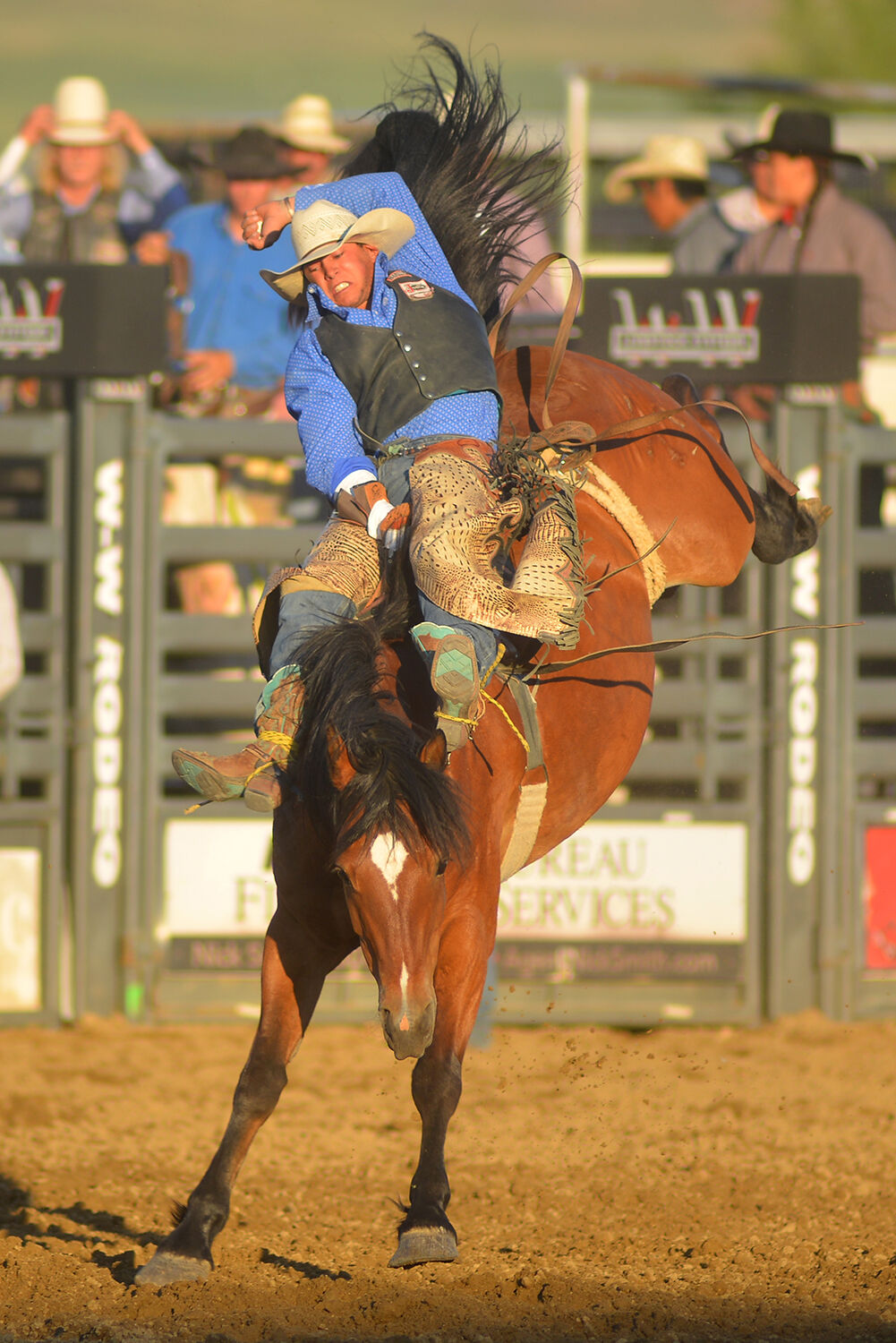 Dylan Sanvick kicks his feet forward as his horse bucks